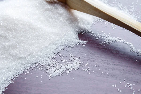 Sugar on wooden table. Selective focus — Stock Photo, Image