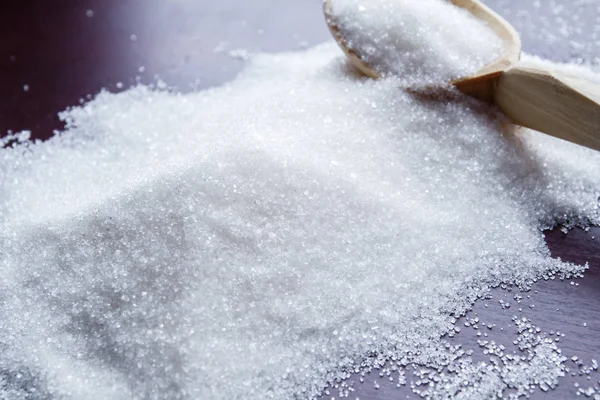 Sugar on wooden table. Selective focus — Stock Photo, Image