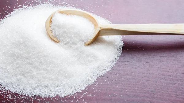 Sugar on wooden table. Selective focus — Stock Photo, Image