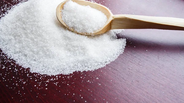 Sugar on wooden table. Selective focus — Stock Photo, Image