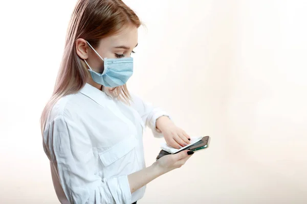 Young Blonde Girl White Blouse Medical Mask Wipes Smartphone Antiseptic — Stock Photo, Image