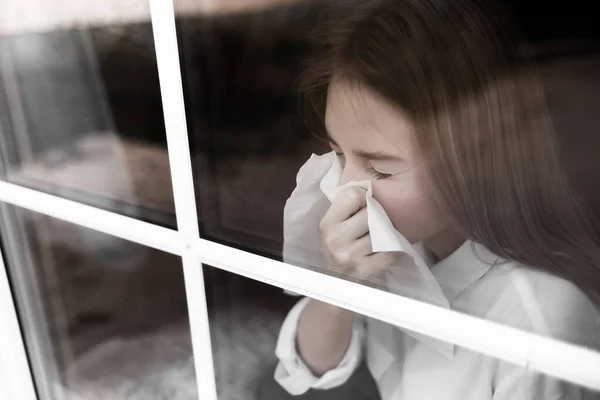 Young Blonde Girl White Blouse Medical Mask Sits Window Looks — Stock Photo, Image