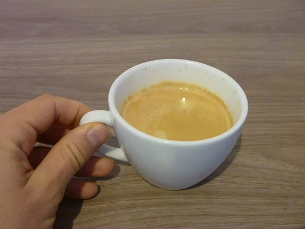 Cup of coffee in a human hand — Stock Photo, Image