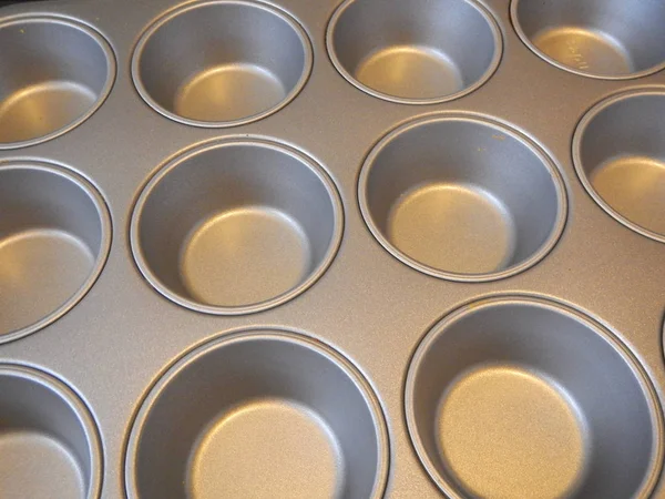 Empty metal form for muffins — Stock Photo, Image