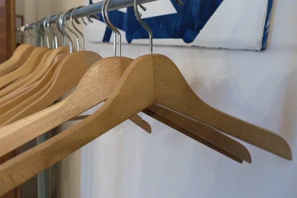 Detail of empty coat hangers on a line — Stock Photo, Image