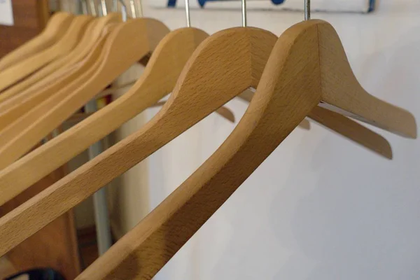 Detail of empty coat hangers on a line — Stock Photo, Image