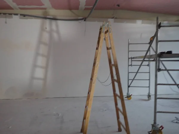 Building site with plasterboards and a ladder — Stock Photo, Image