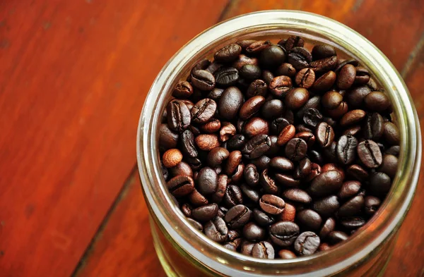 close up coffee berry in bottle