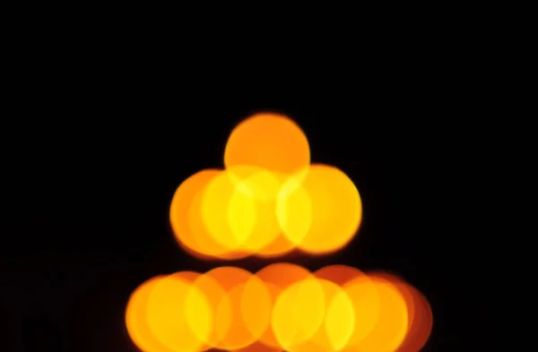 Bokeh di candele luce ambrata Foto Stock Royalty Free