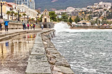 The lower embankment, the chapel of the martyrs and confessors of the Russian, view of the city and mountains is on the photo. Yalta, Crimea. Photo was taken November 13, 2016. clipart
