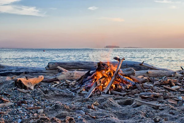 Bonfire near water.