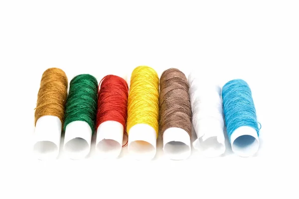 Many colors thread rolls On white background — Stock Photo, Image