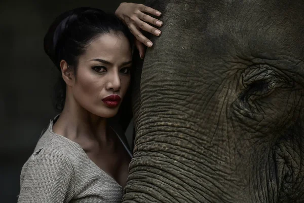 Portrait art of beautiful women and elephants in nature