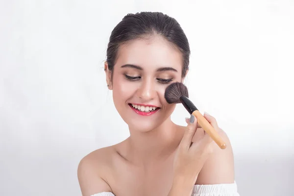Beautiful woman is happy with makeup On a white background — Stock Photo, Image