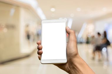 Bir smartphon üzerinde arka plan bulanık tutan el