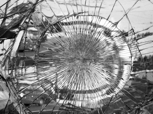 Broken mirror glass in which is reflected the city, black-white version.