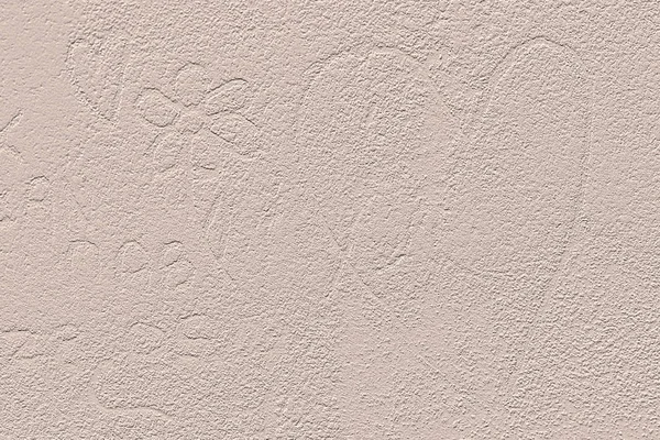 Symbol of heart and flower scribbled on beige plastered wall. — Stock Photo, Image