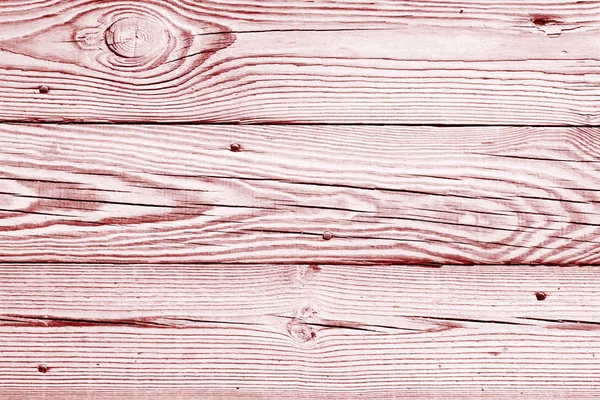 Фон светло-красных древесных плит, текстура деревянного пола, блекло-розовые старые панели с ногтями . — стоковое фото