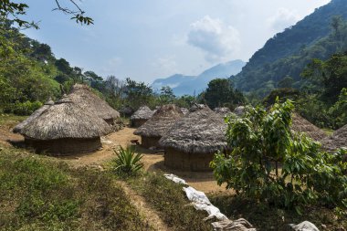Kogi village in the forest in the Sierra Nevada de Santa Marta in Colombia clipart