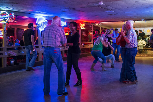 Austin, Texas - June 3, 2014: People dancing in the Broken Spoke dance hall in Austin, Texas, USA