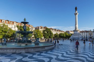 Lisbon, Portugal - October 22, 2017: View of the Rossio Square with tourists walking by, in the pombaline downtown of the city of Lisbon, Portugal clipart