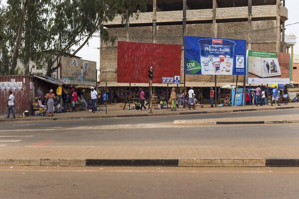 Bissau, Republic of Guinea-Bissau - January 28, 2018: Street scene in the city of Bissau with people at the Bandim Market, in Guinea-Bissau, West Africa