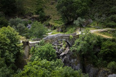View of the ancient Mizarela Bridge (or Devil Bridge) at the Peneda Geres National Park, in Portugal, Europe