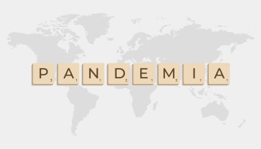 Mavi arka planda dünya haritası olan Scrabble harfleriyle pandemia