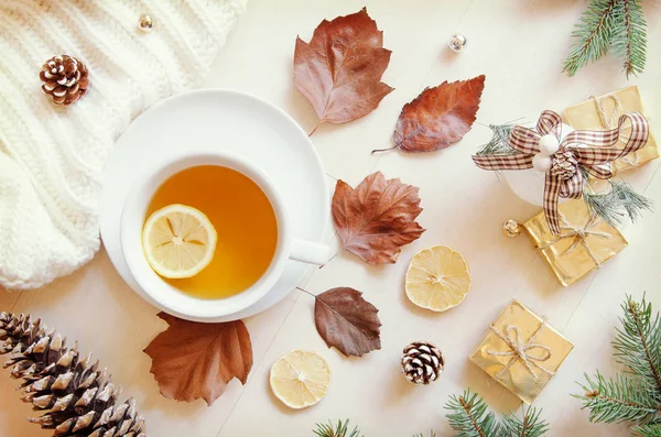Composition with tea, leaves, cone,lemon and knitted sweater. Top view, flat lay — Stock Photo, Image
