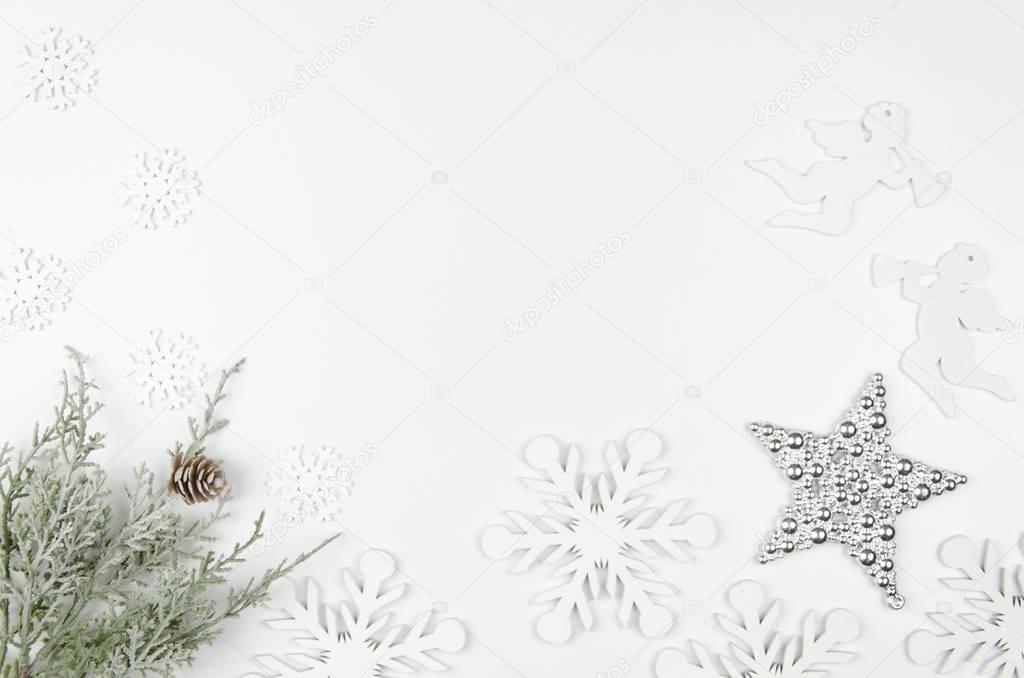 Christmas mockup flat lay styled scene with christmas decorations, angels and snowflakes . Copy space White wooden background