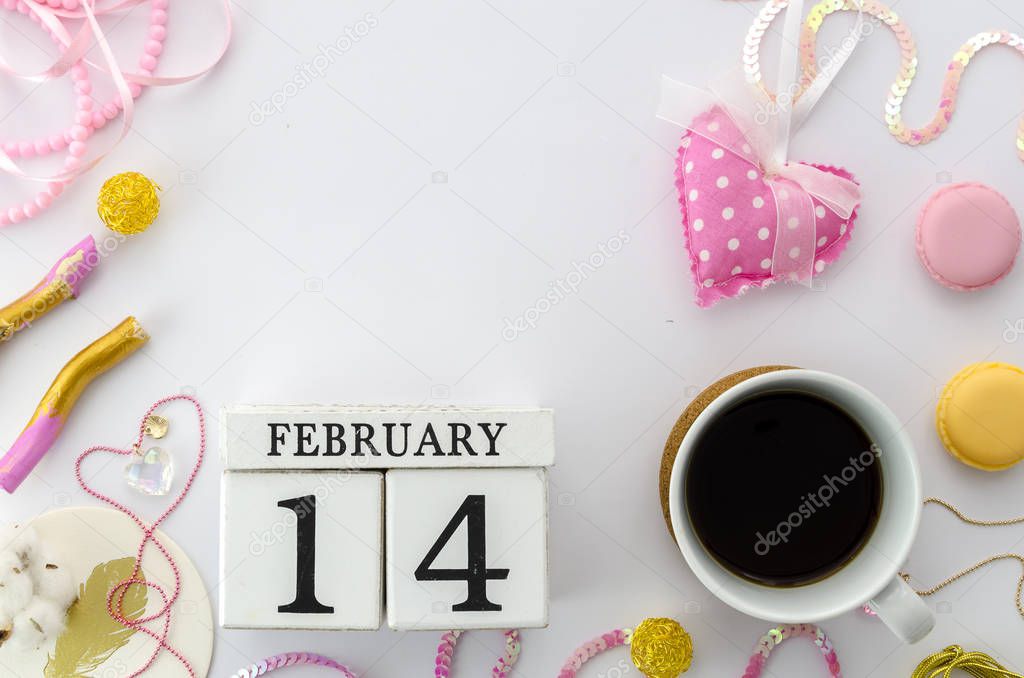 Valentines day concept with white wooded perpetual calendar and cup of coffee. Flat lay mock up with romantic acessories for your lettering. Copy space. Love