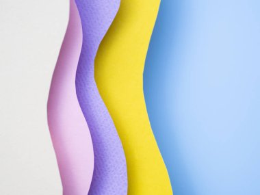 Soyut sanat arkaplan üstü görünümü yumuşak gölgeli çok renkli dalgalı kağıttan yapılmıştır