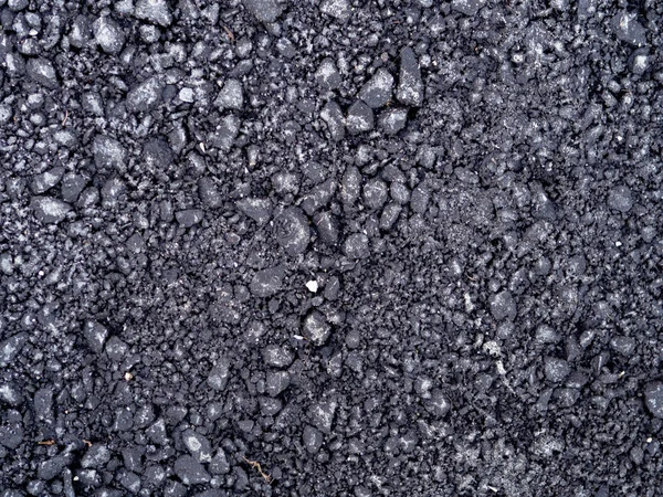 Top view ciemnoszary świeże tekstury drogi asfaltowej z małymi skałami — Zdjęcie stockowe