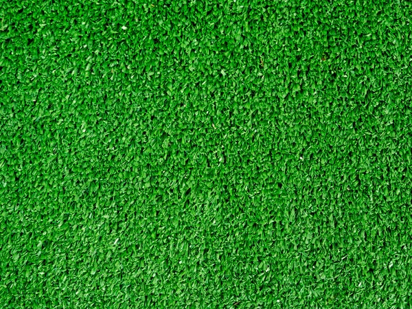 Flat lay artificial grass made of green synthetic fibers. Top view evergreen lawn background — Stock Photo, Image