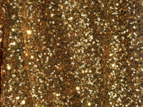 Goud textiel geborduurd met pailletten glanzende textuur — Stockfoto
