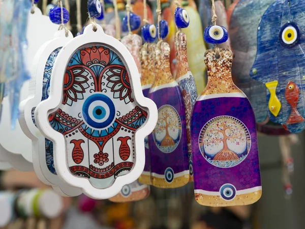 The hamsa with Evil eye amulet protection symbol in a Jerusalem, Israel souvenir shop. Middle east and Moroccan Khamsa symbol