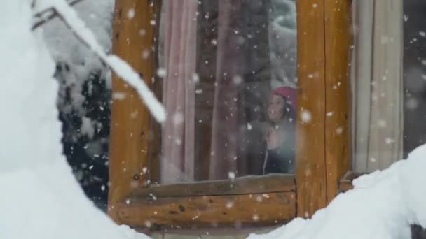 Little Girl Watching the Snow fall — Stock Video