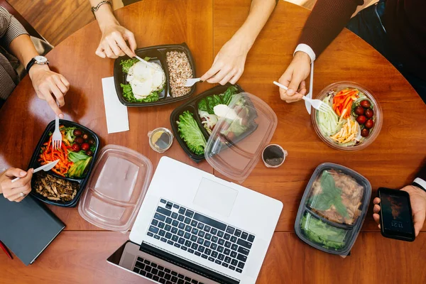 Lunch at the office. Colleagues have lunch together.