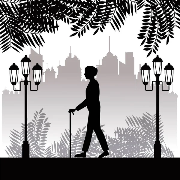 Silhouette aîné homme marche bâton parc twon fond — Image vectorielle