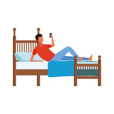 Yatakta cep telefonu kullanan bir adam.