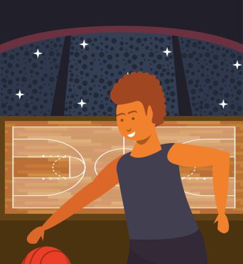 Genç adam balonla basketbol oynuyor.