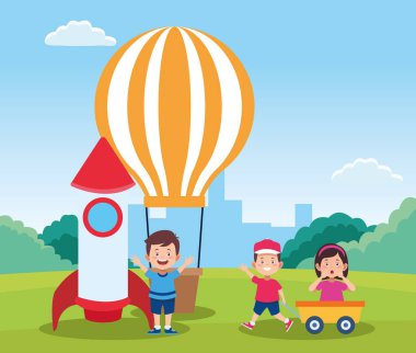 Sıcak hava balonu ve çizgi filmdeki mutlu çocuklarla uzay roketi.