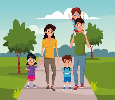 Parkta küçük çocukları olan mutlu bir aile.