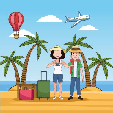 tourist couple on the beach with suitcases