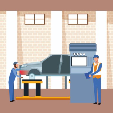 Araba tamircilerinin kaldırılmış araba üzerinde çalıştığı araba atölyesi manzarası