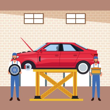 Araba atölyesi sahnesi. Araba lastiği ve aküsü olan tamirciler.