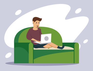 Evde dizüstü bilgisayar kullanan bir adam