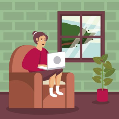 Oturma odasında dizüstü bilgisayar kullanan kişi