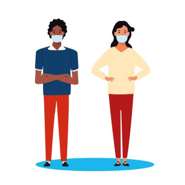 Kovid19 için yüz maskesi kullanan ırklar arası bir çift.