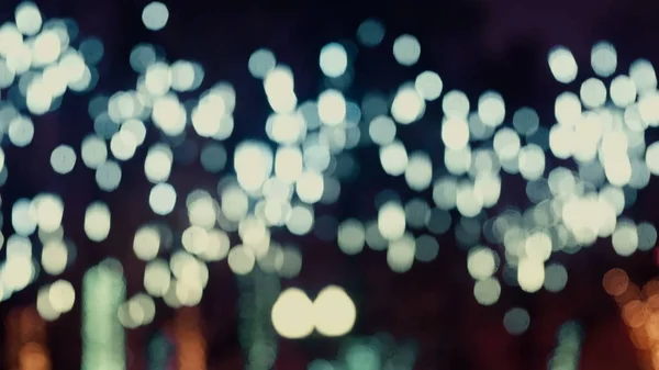 Colorful, blurred, bokeh lights background in cold tones. Abstract sparkles. — Stock Photo, Image